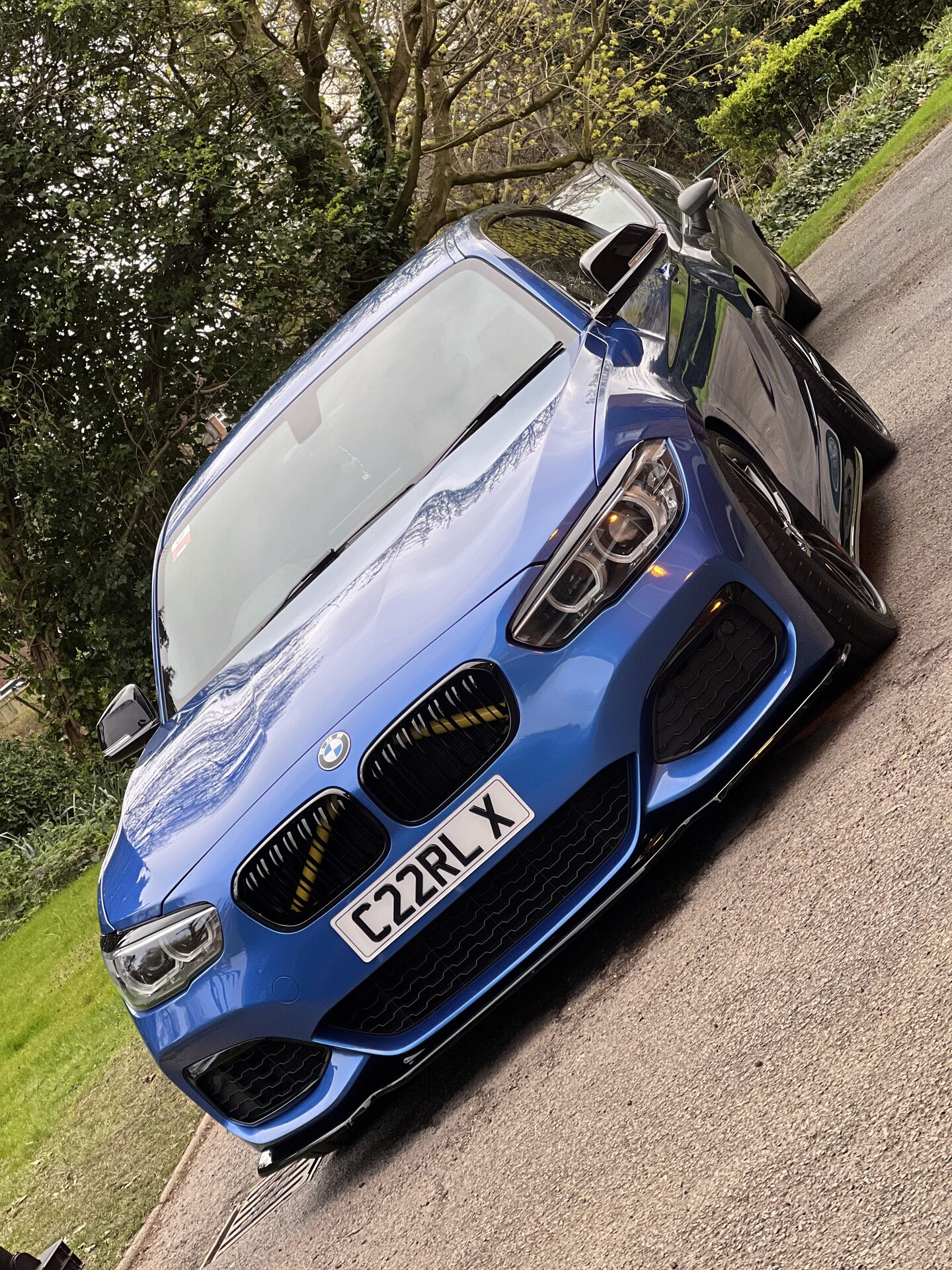 Estoril Blue BMW M140i front end with carbon splitter after multi-stage paint correction by Auto-Glo in Warwickshire